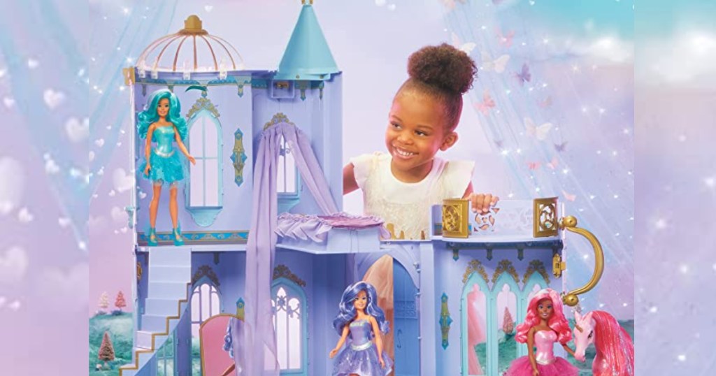 Girl playing with Doll House