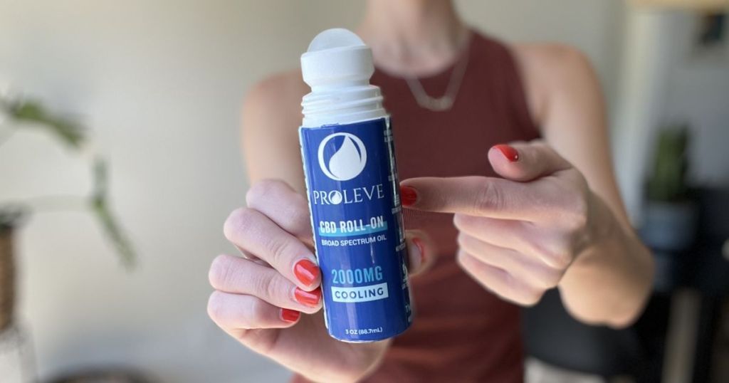 woman holding a Proleve Cooling Roll-On
