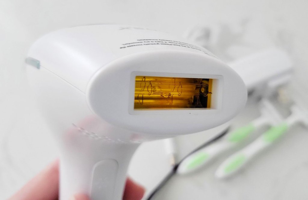holding a laser hair remover