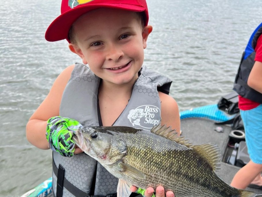 child holding fish