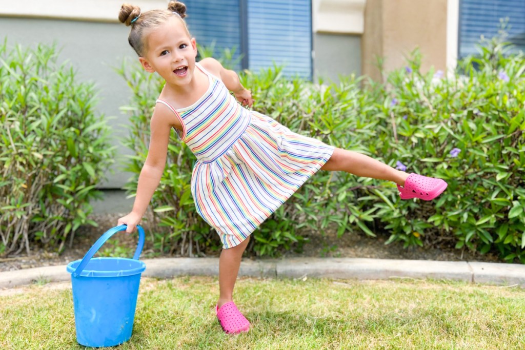 girl with pink totes sandals