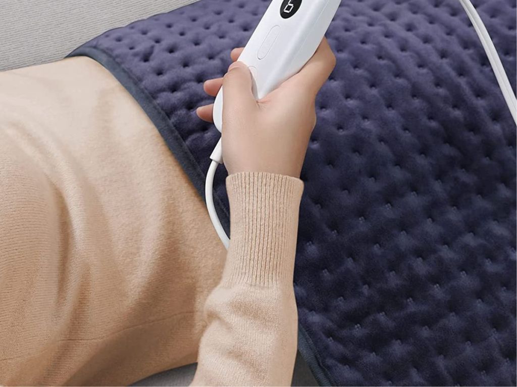 person using Evajoy Heating Pad