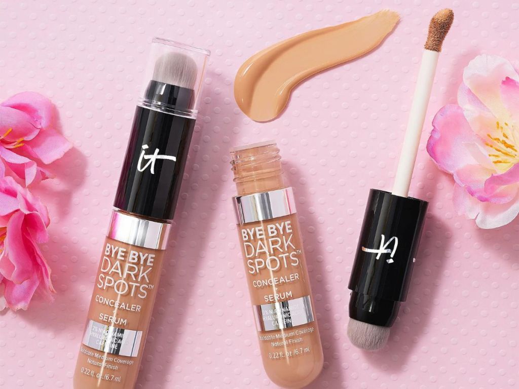 two it Cosmetics Bye Bye Dark Spots Concealers with flowers around them