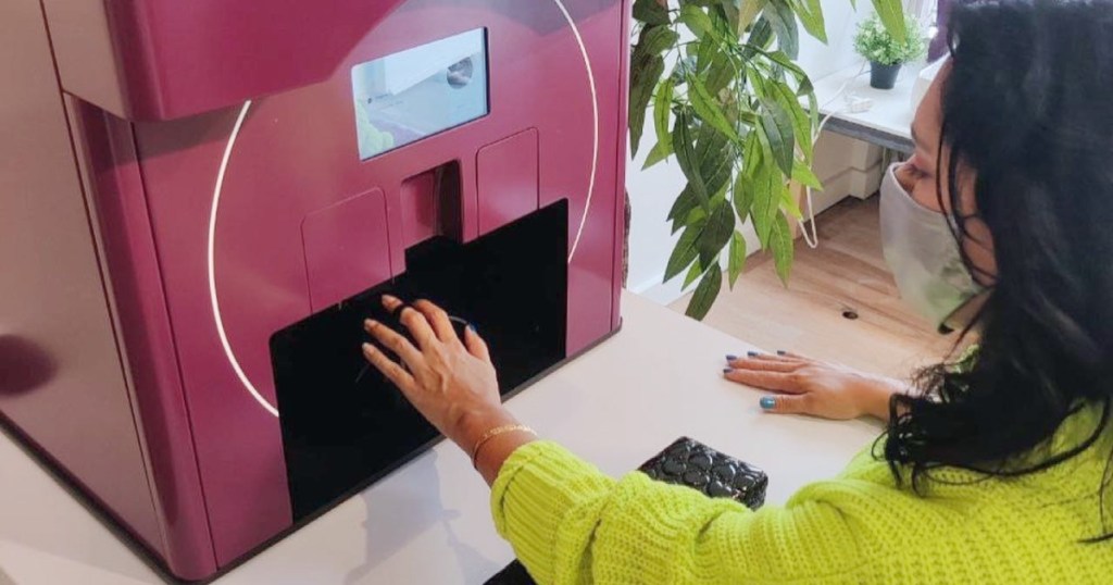 woman getting robot manicure