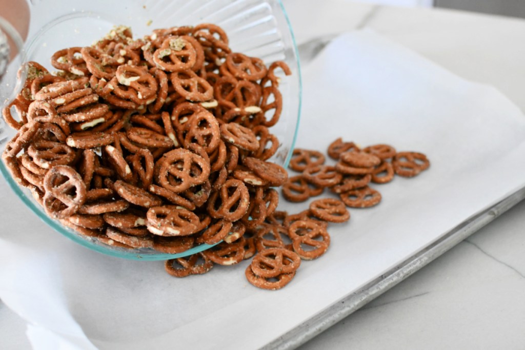 pouring pretzels on a sheet pan