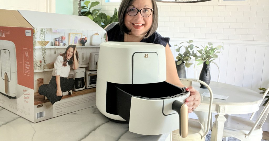 woman holding beautiful walmart air fryer