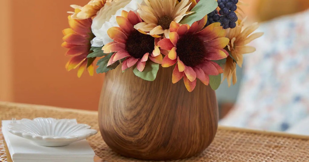 faux floral arrangement in woodgrain pot