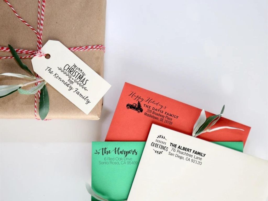 gift tag and envelopes with stamp holiday greetings