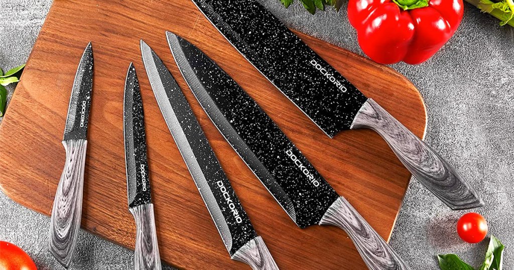 black knife set on wood cutting board