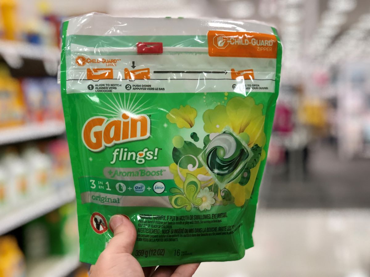 hand holding a bag of Gain Flings