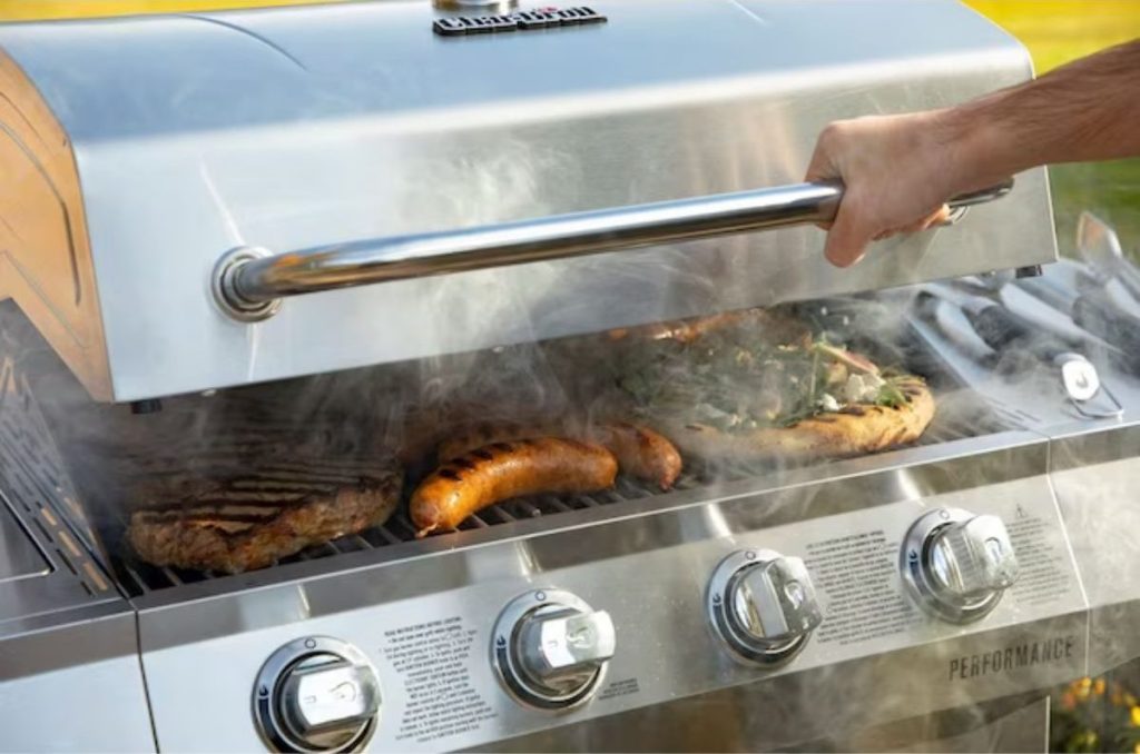 Charbroil Grill with hand opening the lid