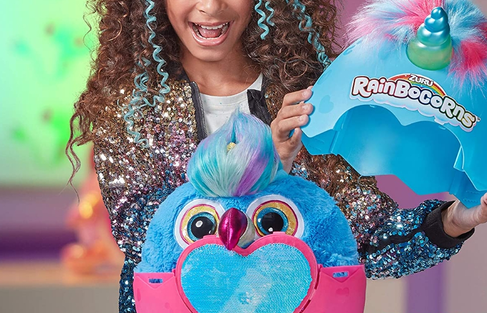 girl opening a Rainbocorns Big Hair Surprise