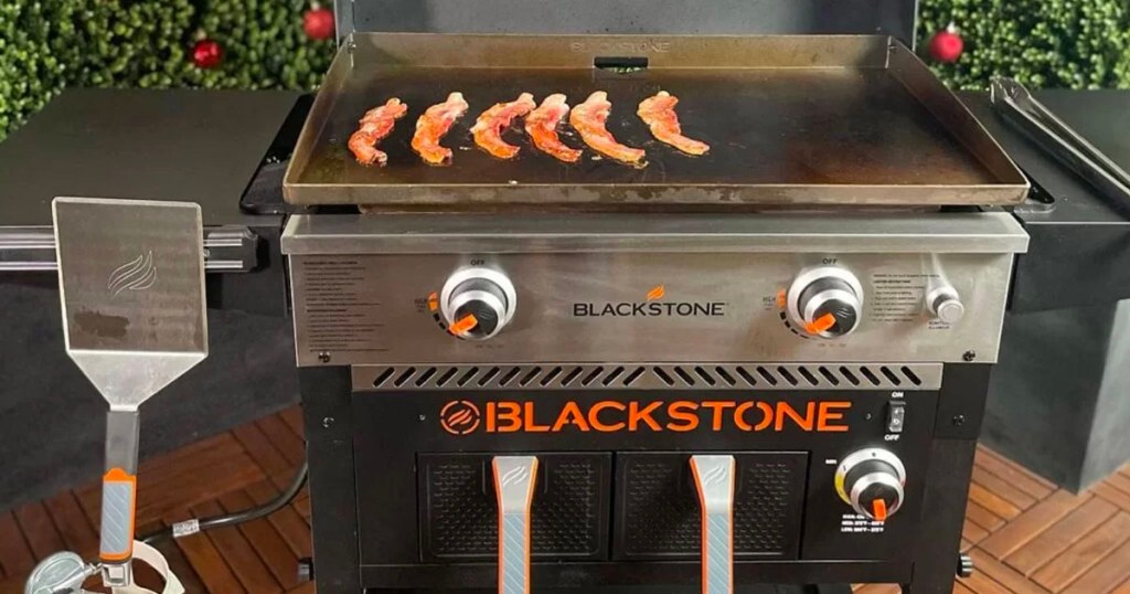 blackstone air fryer with bacon strips cooking on griddle