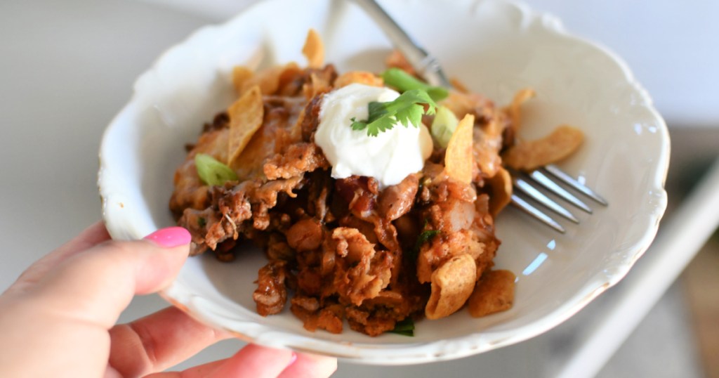 holding plate with frito pie