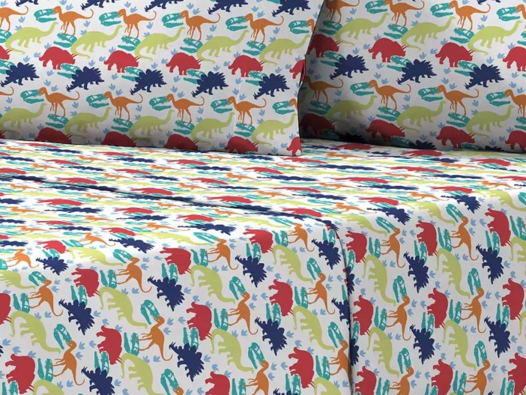dino sheets on bed