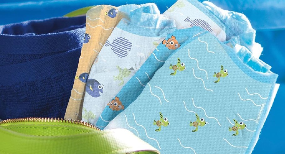 swimming diapers in three different designs showcased in a beach bag