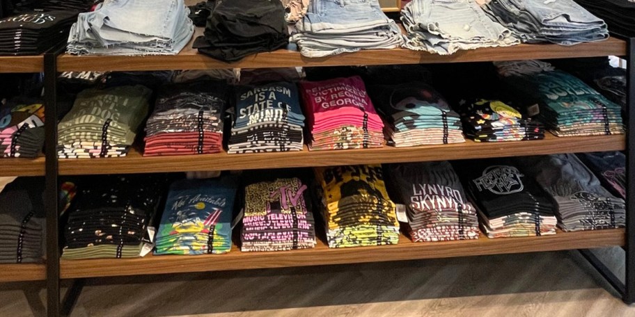 torrid graphic tees on shelf in store