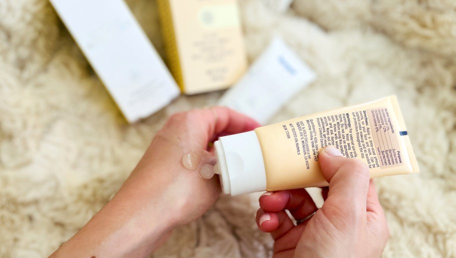 close up of hand squeezing beauty product on fist