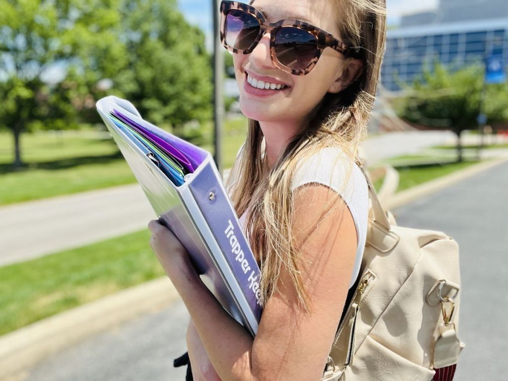 woman carrying Trapper Keeper