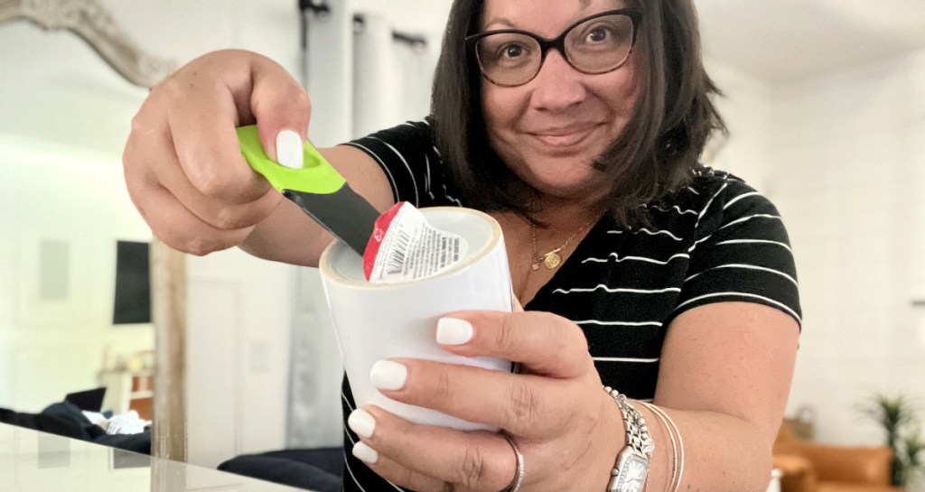 woman using thumb scraper