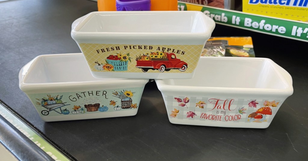 mini fall-themed loaf pans on store conveyor belt