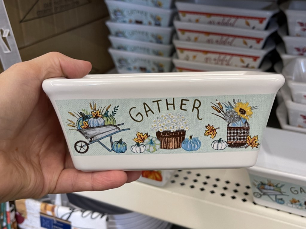 hand holding fall-themed loaf pan in store