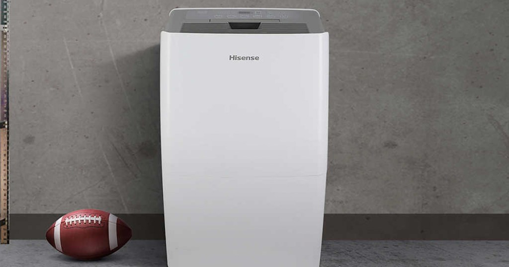 hisense dehumidifier in basement next to a football