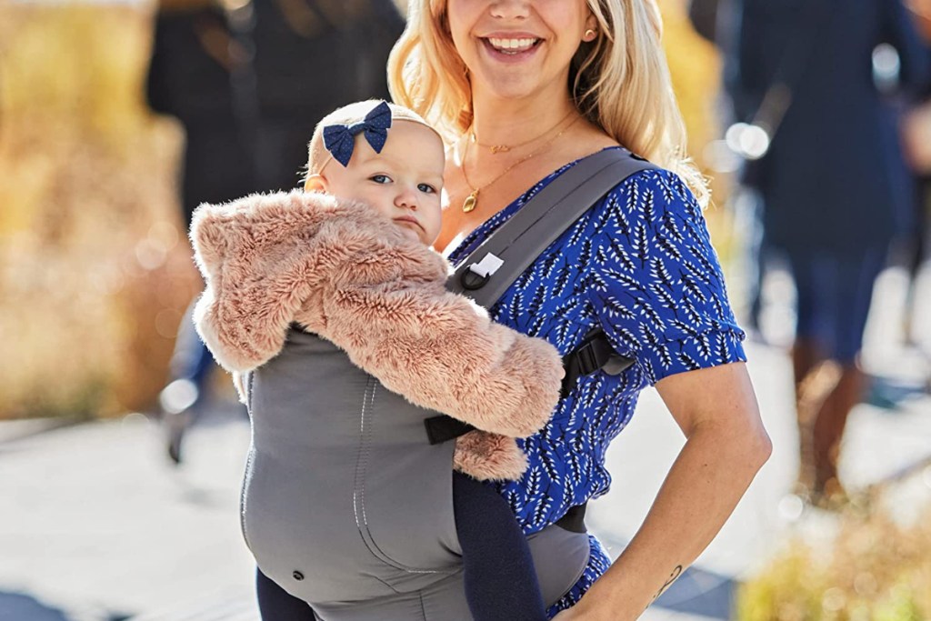 Mom holding baby in infant carrier