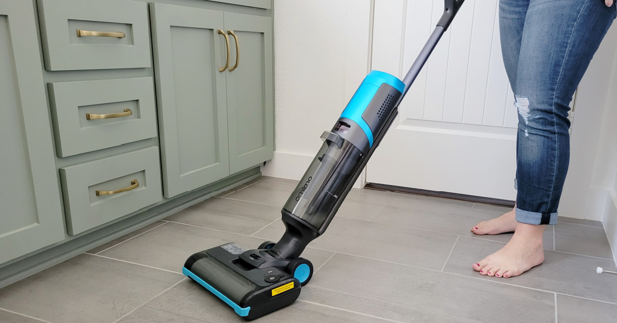 woman in kitchen using Oraimo Cordless Wet Dry Vacuum Cleaner