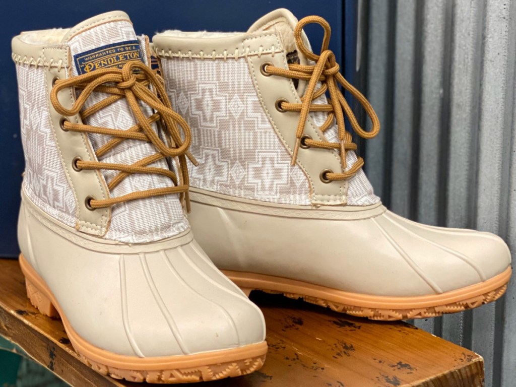 pair of taupe and white print duck boots