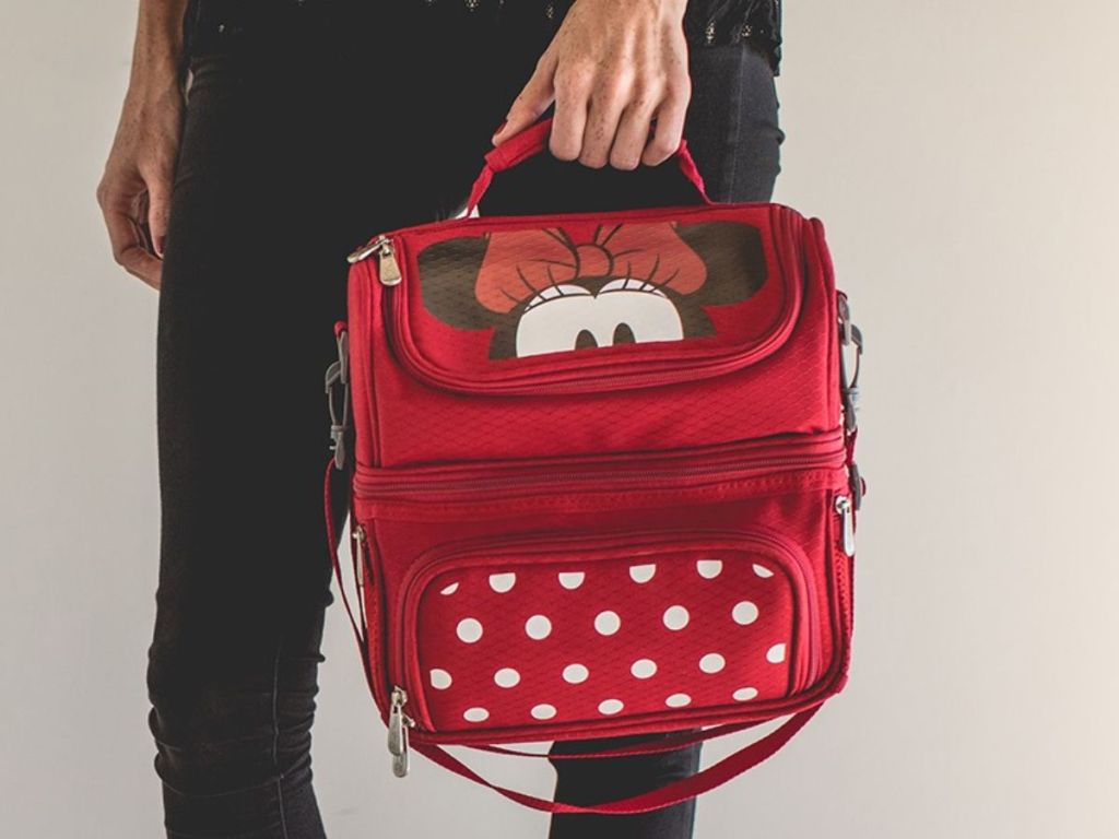 Woman holding a Minnie Mouse Picnic Time Cooler Bag