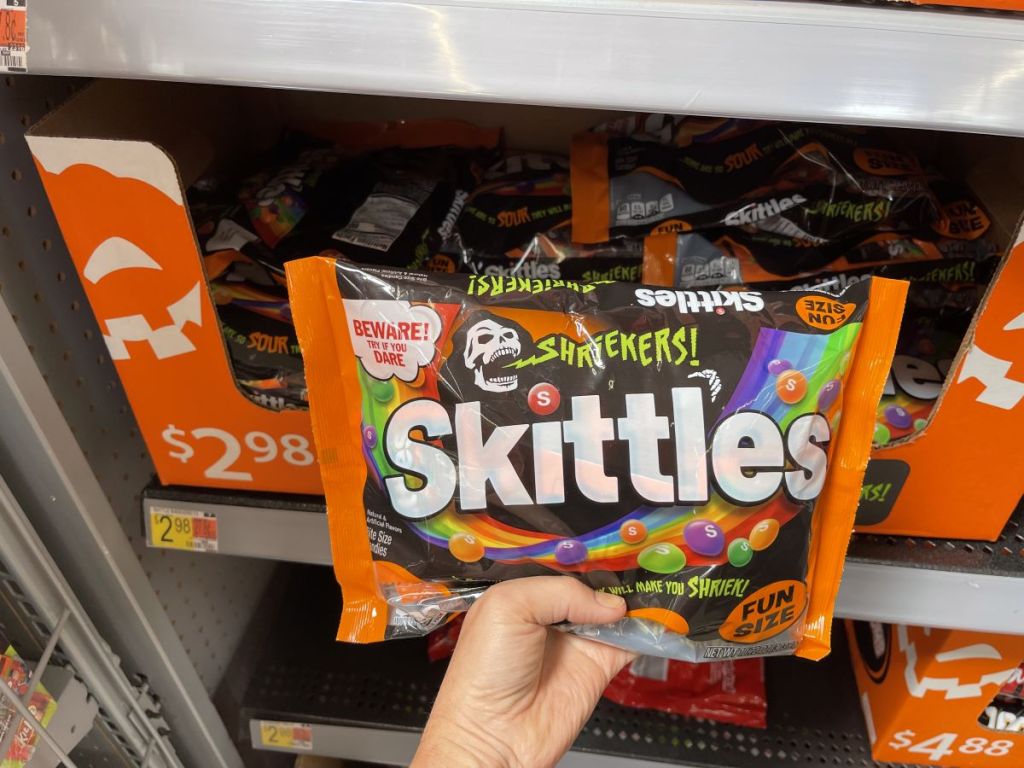 hand holding a bag of Skittles Shriekers Sour Halloween Chewy Candy Fun Size Bag