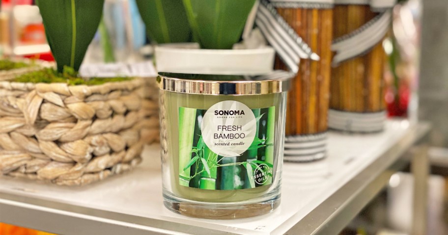 bamboo scented candle on white shelf