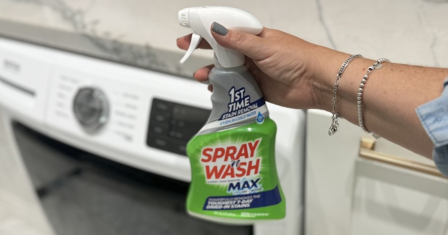 bottle of spray 'n wash laundry spray in front of washing machine