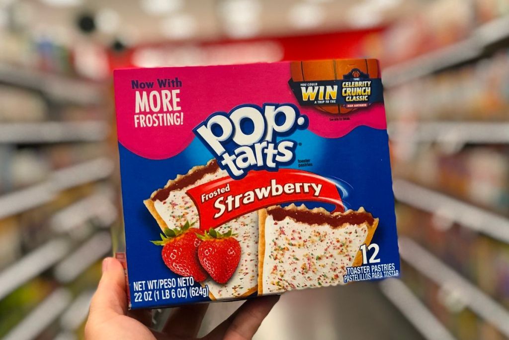 a mans hands holding up a 12 count box of Strawberry frosted pop tarts