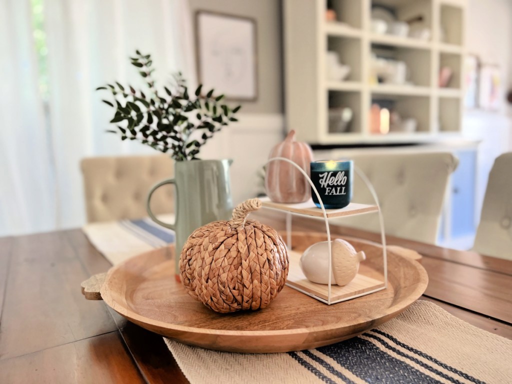 decorating a fall table from Target with fall candle