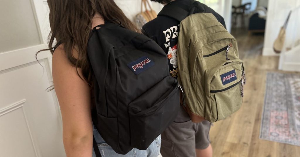 2 teens wearing jansport backpacks