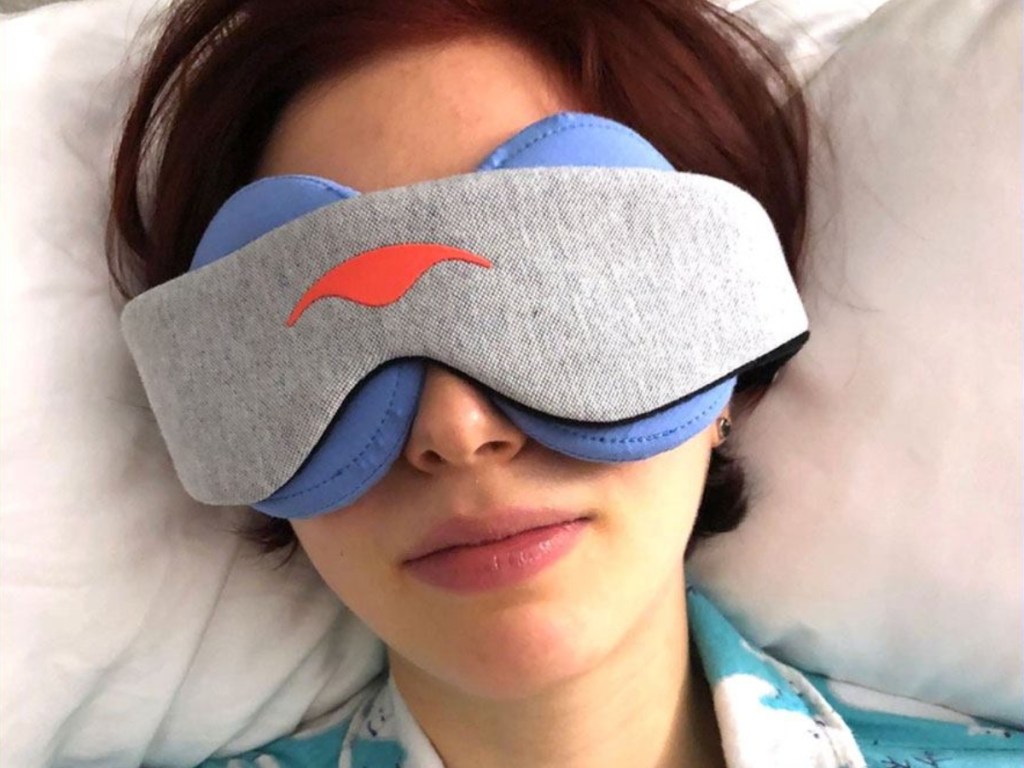 woman wearing sleep mask