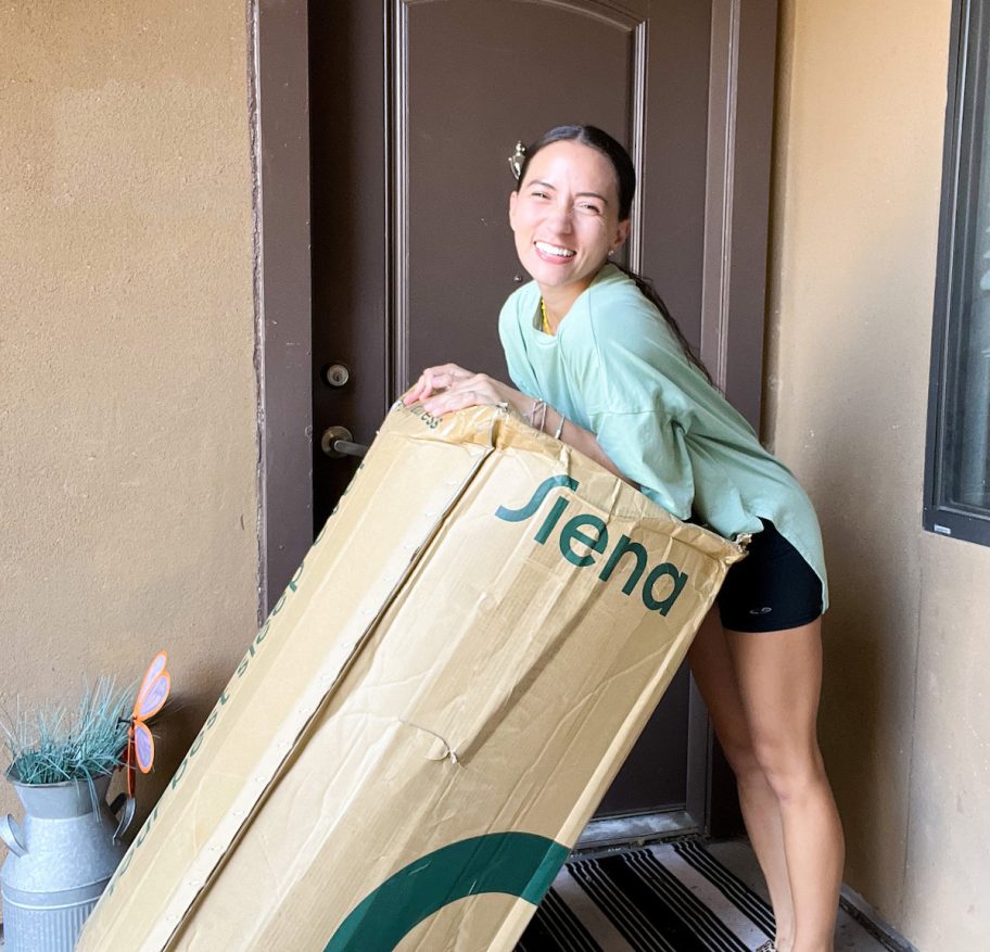 woman outside on front porch leaning on siena best mattress in a box