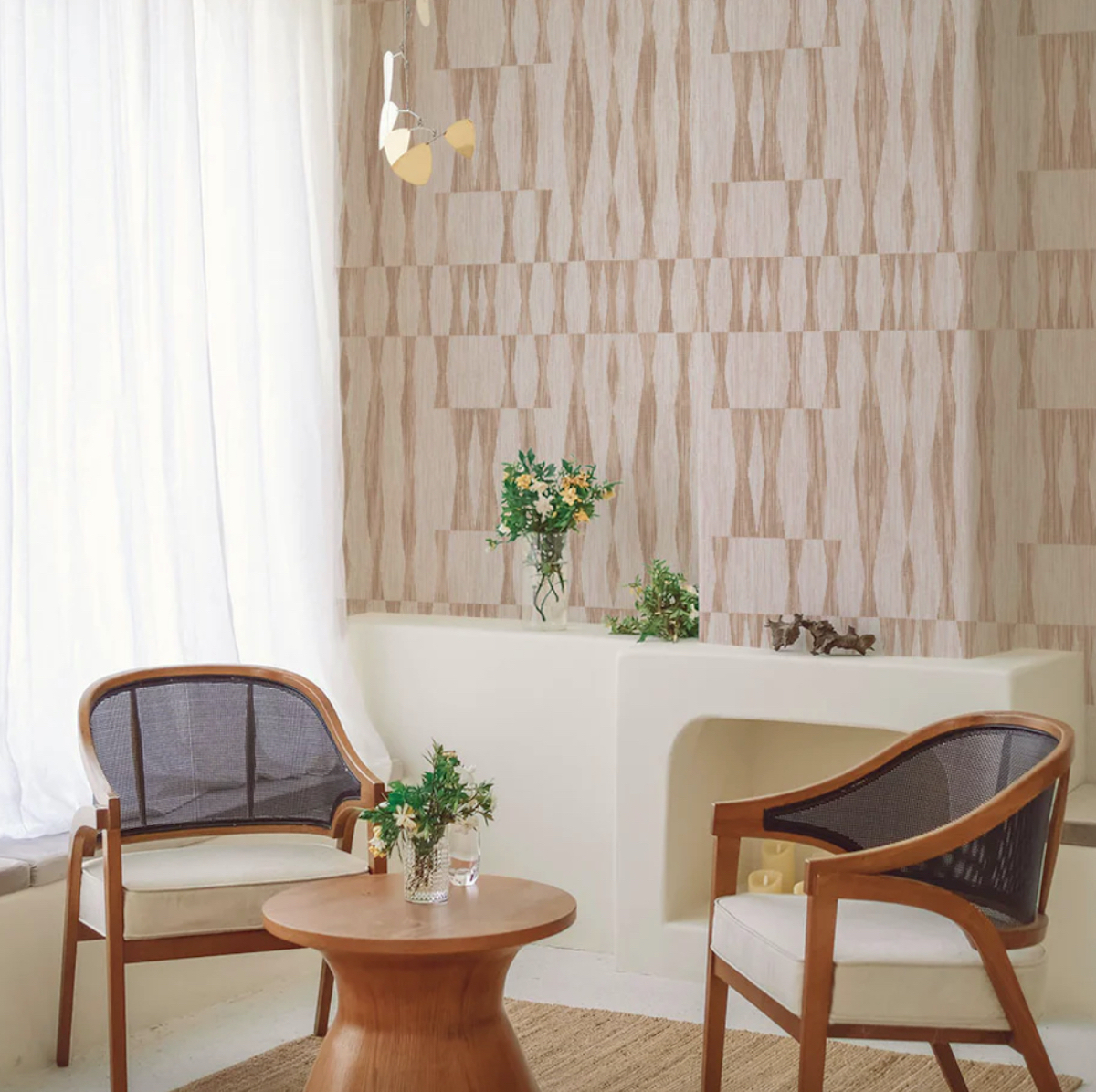 styled dining room with bistro style chairs and table with wallpaper on walls