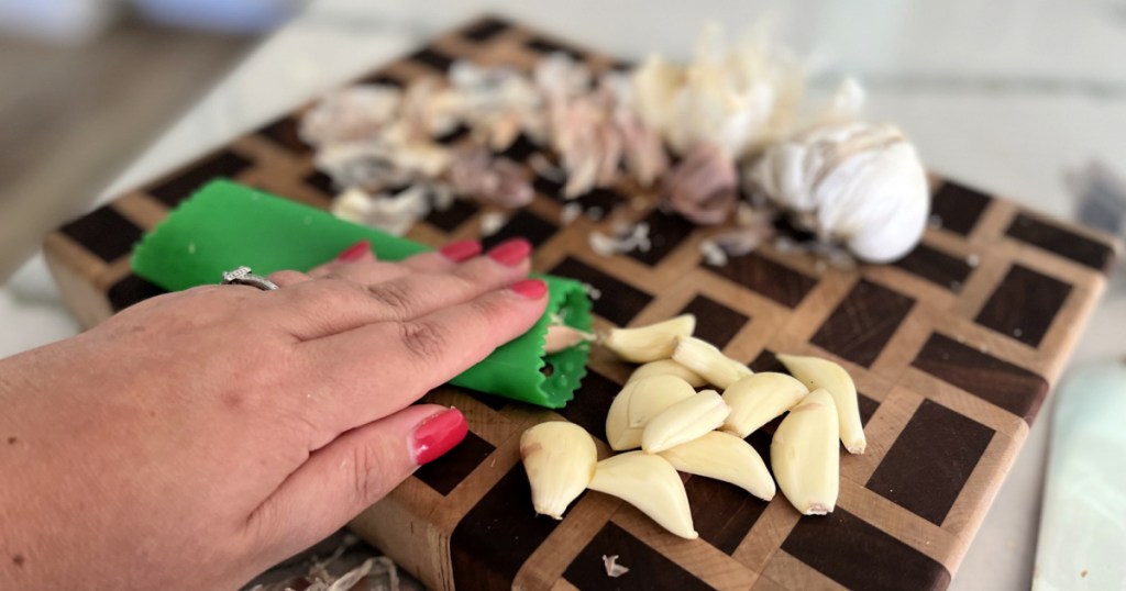 using a garlic peeler to quickly peel garlic cloves is one of our favorite kitchen hacks