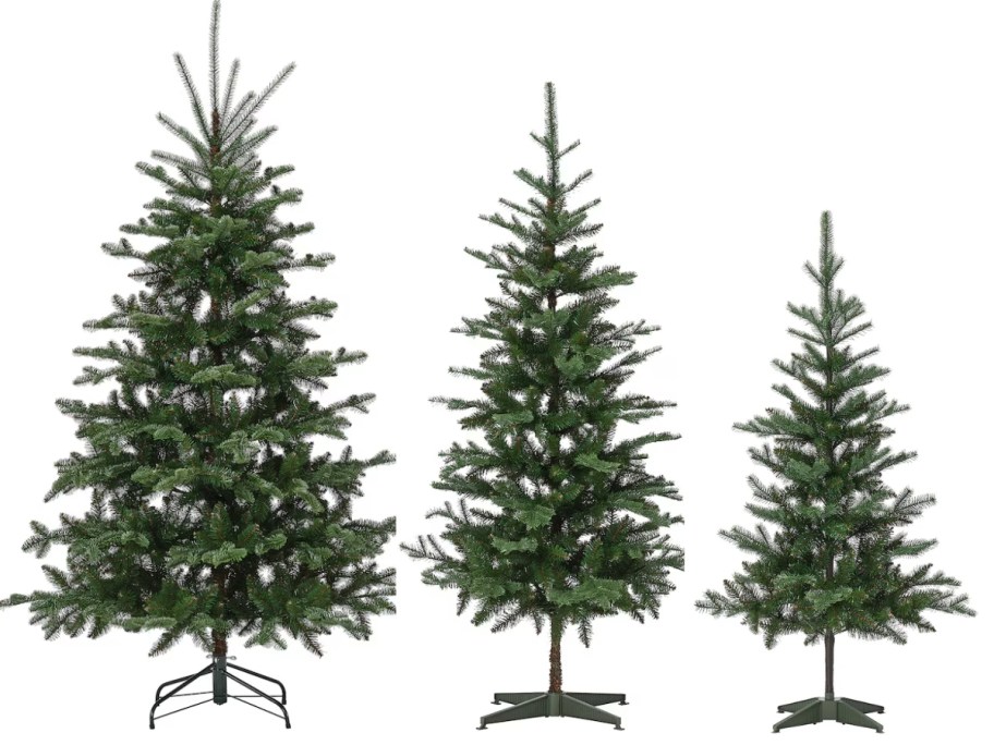 3 artificial Christmas trees in tall, medium, and smaller sizes