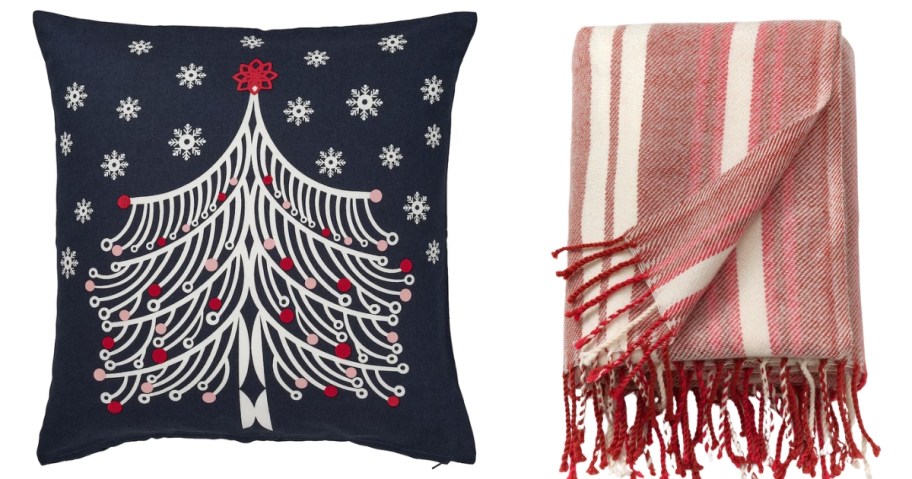 a blue pillow with a Christmas tree and a red and cream stripe throw blanket