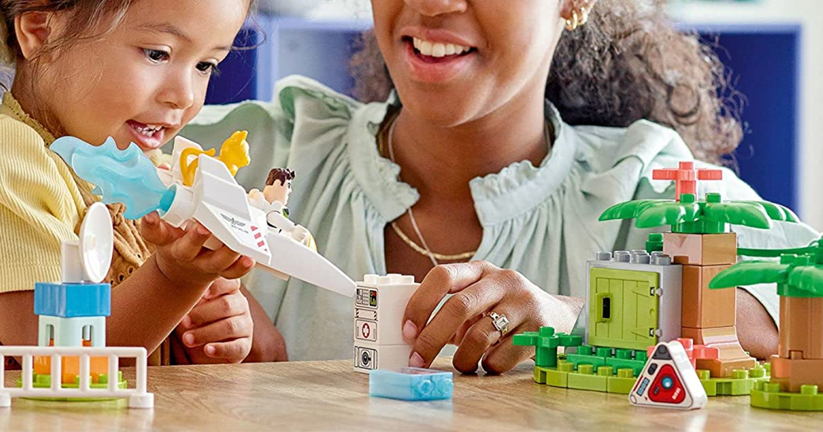 kid and mom playing with lego duplo buzz set