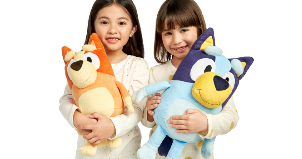girls holding Bluey Plush Dolls