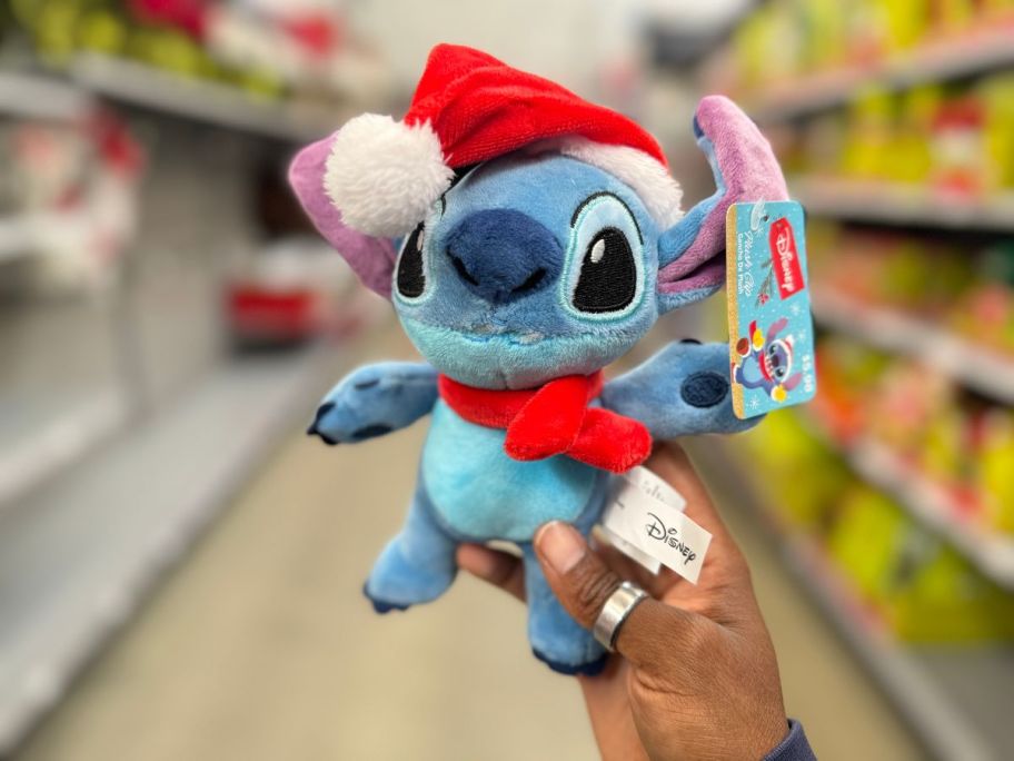 hand holding Disney Christmas Stitch Plushie