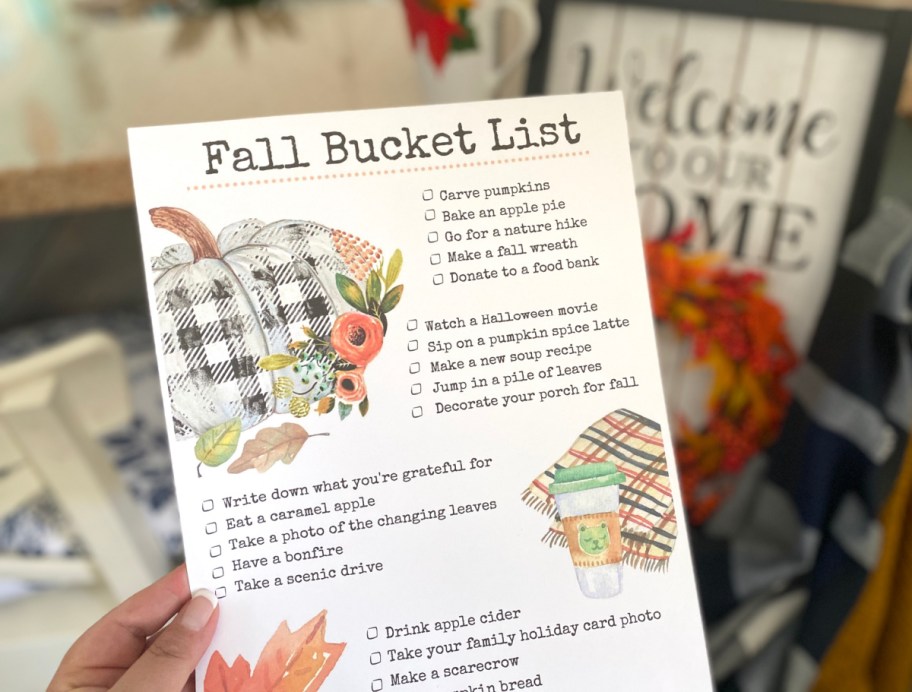 hand holding up a free fall bucket list
