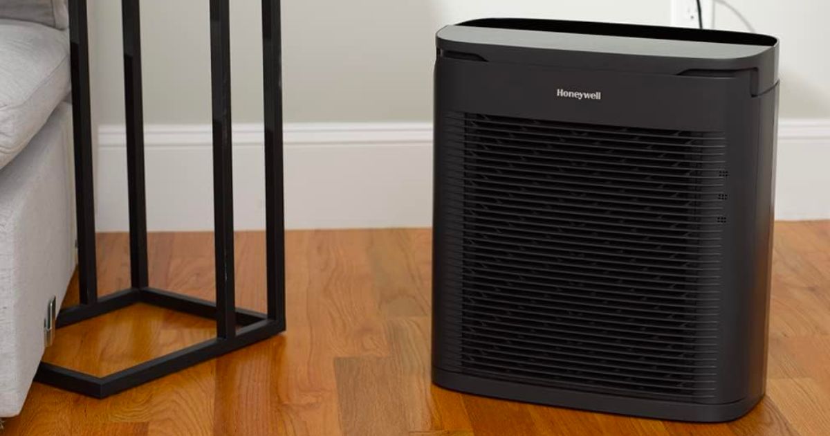 Honeywell PowerPlus HEPA Air Purifier ina living room next to an end table