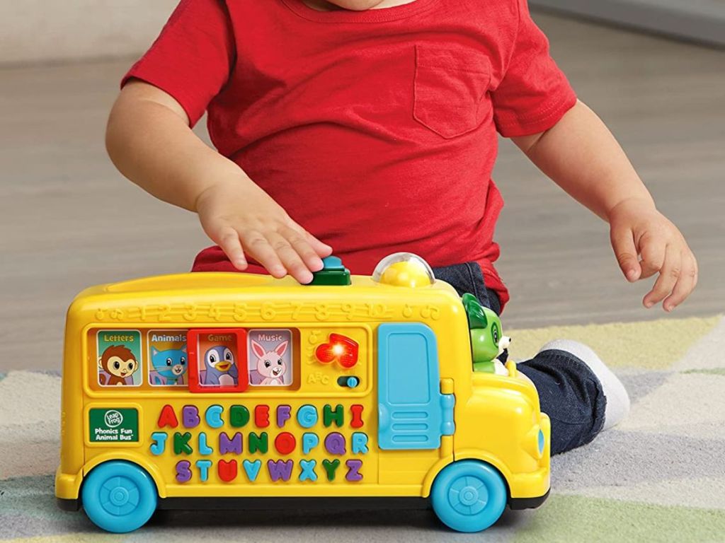 baby playing with Leap Frog phonics bus