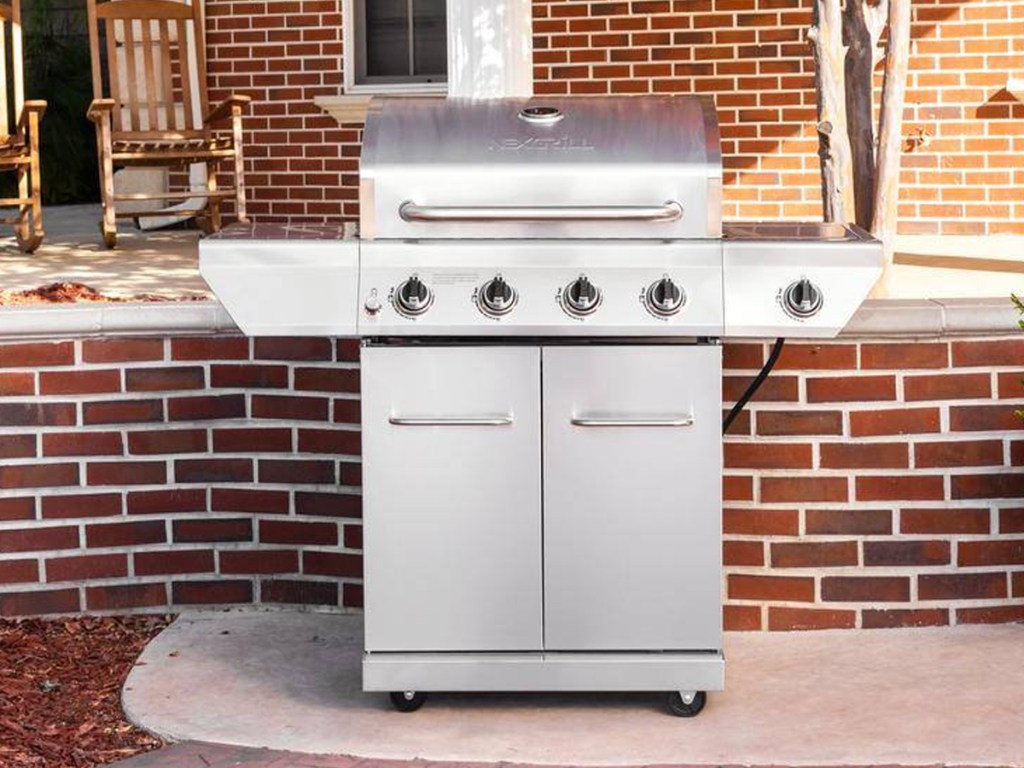 stainless steel propane grill on patio
